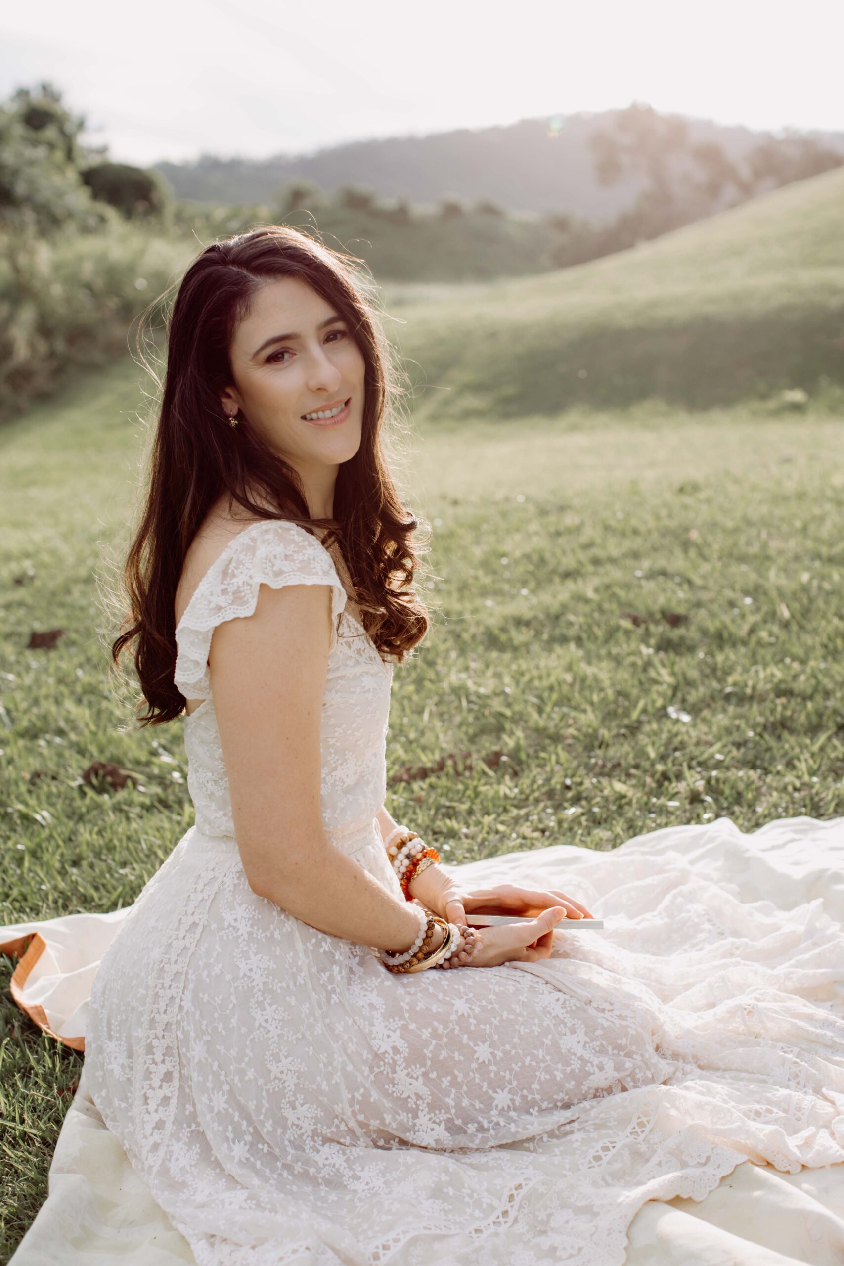 JodiPlumbley_Simmone-2 Simmone Helander sitting outdoors on the grass in soft afternoon light